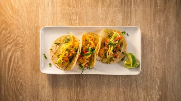 Beachside tacos with lime served on a platter for a Naples beach setup