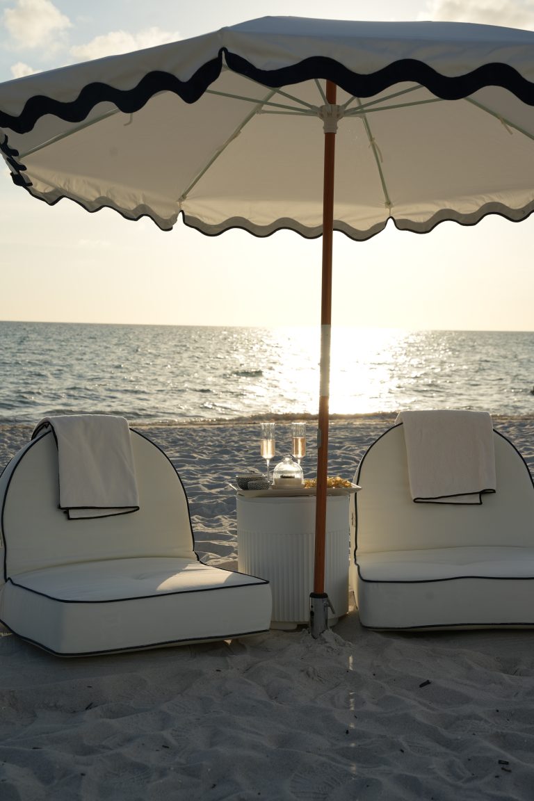 A family beach day setup waiting on the sand